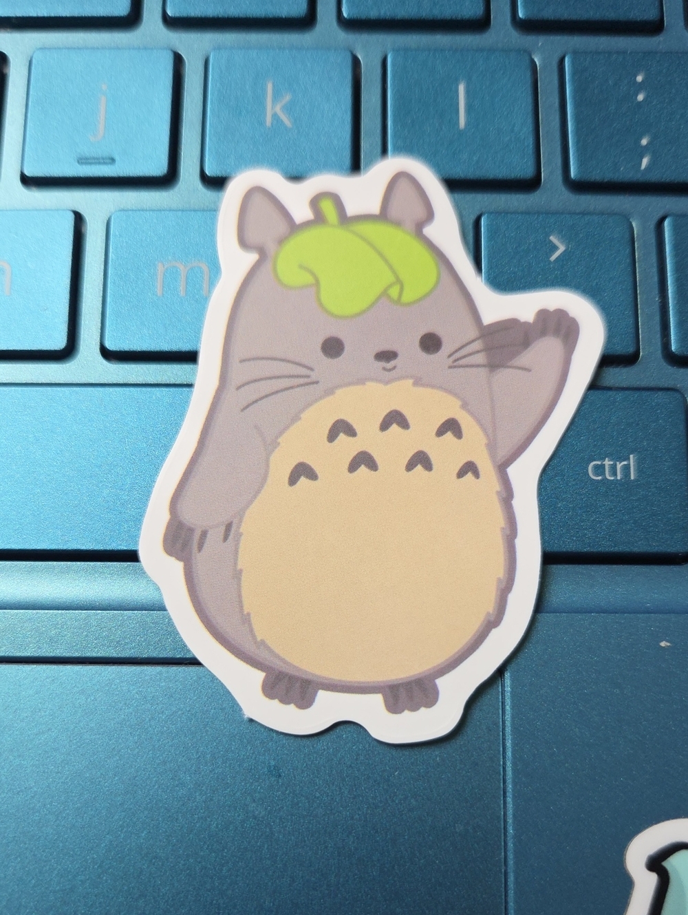 Gray and Cream Cat Sticker with Green Leaf Accent - Cute Pet Character Decal